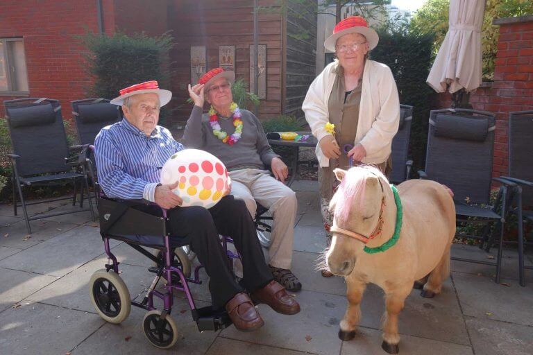 Two elderly men and one woman