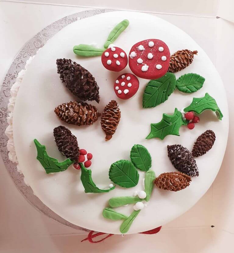 A decorated cake featuring natural motifs