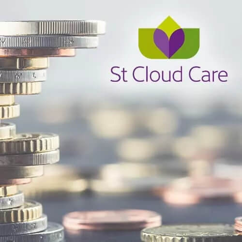 A stack of coins with the words st cloud care