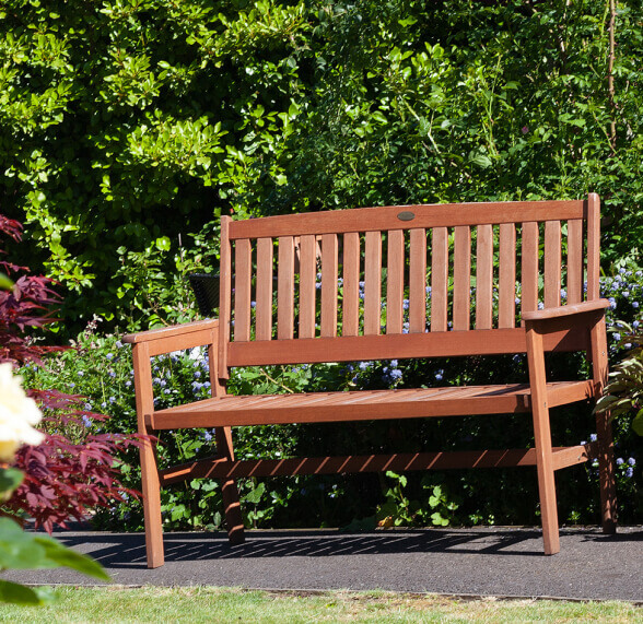 Photo of a wooden chair placed in a garden in Acacia Care centre