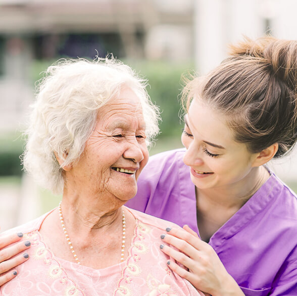 A caretaker and an old woman in henley on thames care centre