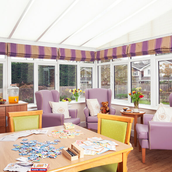 A Hamilton care home room with a table and chairs