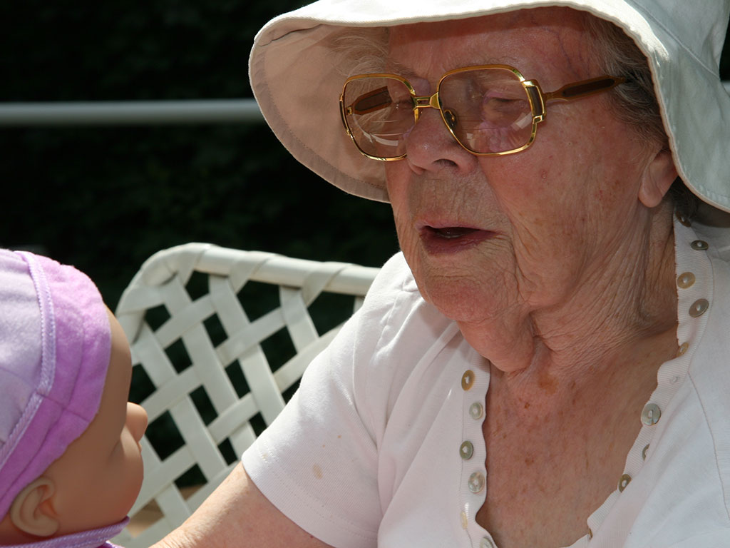 elderly-woman-with-doll