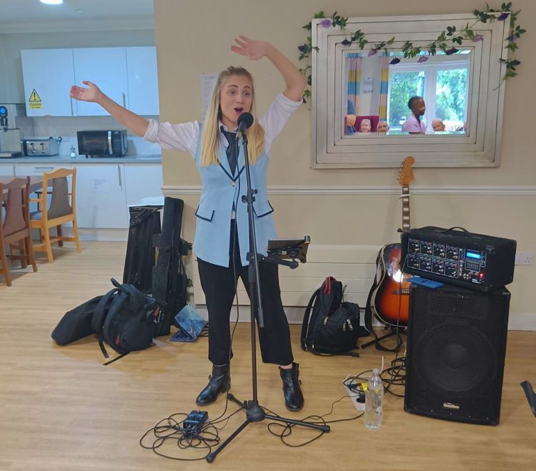 A woman is performing indoors